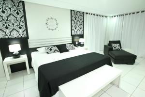 Postel nebo postele na pokoji v ubytování Hits Pantanal Hotel