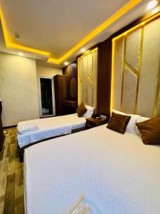 a hotel room with two beds in a room at Liman Hotel in Istanbul +35 photos