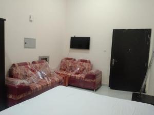 TV a/nebo společenská místnost v ubytování We welcome you to a quiet apartment that will make your stay wonderful - AL RAWDA 2 - AJMAN