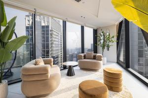 a living room with a view of the city at Magnificent 3BR Spectacular Canal & Burj View in Dubai
