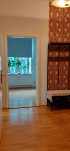 a room with a door with potted plants on a window at Enjoy Goerlitz Augustastrasse in Görlitz