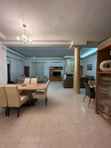 a dining room with a table and chairs at MG Villa Rhodes in Kalithies