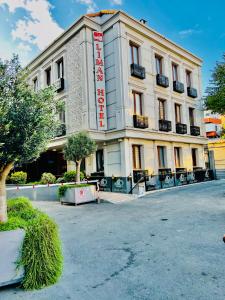 a building with a sign on the front of it at Liman Hotel in Istanbul