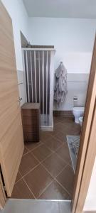 a bathroom with a shower and a toilet in a room at ADRIANA SEAHOUSE in Balestrate +15 photos