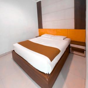 Voodi või voodid majutusasutuse DINASTY STYLE HOTEL SOLO toas