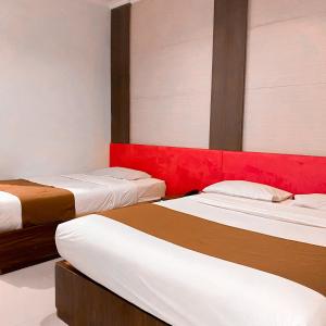 Voodi või voodid majutusasutuse DINASTY STYLE HOTEL SOLO toas
