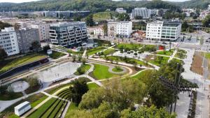 an aerial view of a city with buildings and a park at Bursztyn Lasu in Gdynia