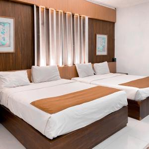 Postel nebo postele na pokoji v ubytování DINASTY STYLE HOTEL SOLO + 14 fotografií
