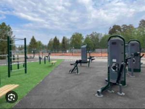 a park with a bunch of exercise equipment in it at Basement apartment in Sandefjord