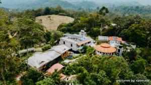 an aerial view of a house in a forest at Tirtha Quddus Farmstay in Bentong