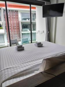 Postel nebo postele na pokoji v ubytování Maya Phuket Airport Hotel-Naiyang Beach