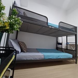 a black bunk bed in a room at M Centura Sentul 2 bedrooms with pool in Kuala Lumpur