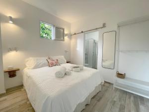 Postel nebo postele na pokoji v ubytování Eden Gomera Suites