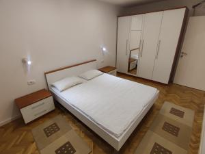 Postel nebo postele na pokoji v ubytování Apartments Šarić
