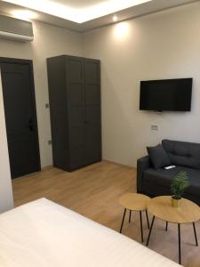 a living room with a couch and a tv at Hotel Nacional in Bosanska Gradiška +30 photos