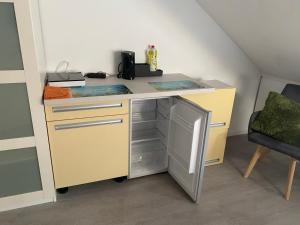 Kuchyň nebo kuchyňský kout v ubytování Ruhiges Zimmer im Gasthaus