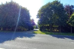 an empty road with trees on the side of it at Millfields cottage and garden in Goxhill