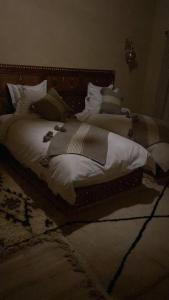 Voodi või voodid majutusasutuse Chalets-Appartements Tourtite toas