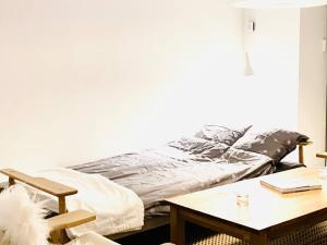 En eller flere senge i et værelse på Cozy Holiday Home - LightHouse by the sea