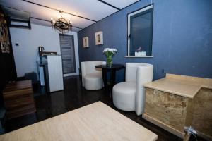 a bathroom with two toilets and a table in a room at Hotel Tigran Mets in Yerevan