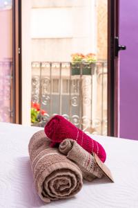 a pink towel sitting on top of a table at CASA RURAL ANGELITA in Rosell