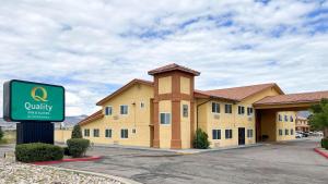 a hotel with a sign in front of a building at Quality Inn & Suites Grants - I-40 in Grants