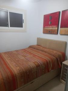 En eller flere senge i et værelse på 1 linea playa YATE