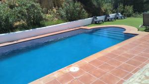 The swimming pool at or close to Casa Las Adelfas