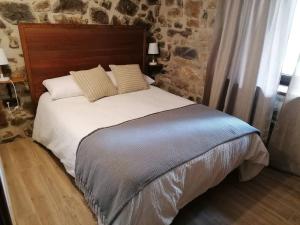 Ένα ή περισσότερα κρεβάτια σε δωμάτιο στο El invernal de Vilabela