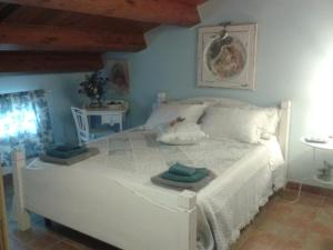 Postel nebo postele na pokoji v ubytování B&B Fonte Cugno