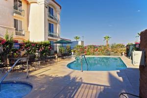 a swimming pool in front of a building at Holiday Inn Express Calexico, an IHG Hotel in Calexico