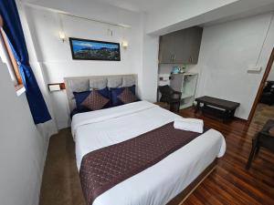 Postel nebo postele na pokoji v ubytování Royal Vista - Guest House