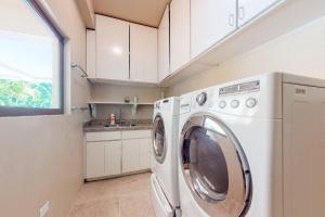 a white washer and dryer in a small kitchen at Morningstar Breeze Gold Standard Certified in Hopkins