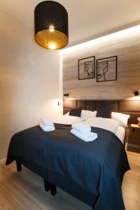 Postel nebo postele na pokoji v ubytování King Street Apartments Budapest Center
