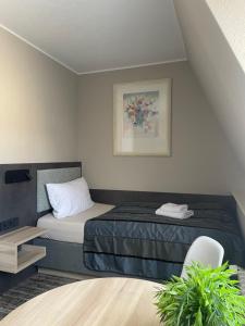 Cama o camas de una habitación en Hotel Corsten
