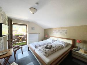 Ένα ή περισσότερα κρεβάτια σε δωμάτιο στο Haus Gertraud
