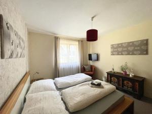 Ένα ή περισσότερα κρεβάτια σε δωμάτιο στο Haus Gertraud