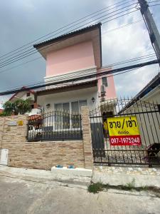 a house with a fence in front of it at bom bomm home for lovery in Bangna
