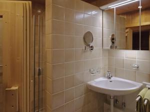 a bathroom with a sink and a mirror at Aparthaus Bianca in Gaschurn +35 photos