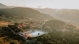 una vista aérea de un complejo en una montaña en Borgo San Pecoraio Resort, en Riparbella