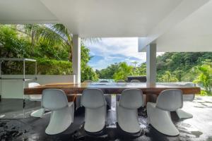 a dining room with a table and chairs at Cozy 5BR Villa Stunning SeaViews in Kamala Beach