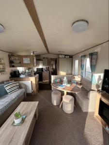 a living room with a couch and a table at Pebble Ridge hoilday home in Northam