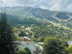 a view of a mountain with a house and trees at Appartement Méribel, 2 pièces, 6 personnes - FR-1-411-717 in Les Allues