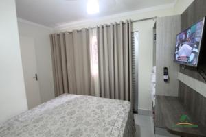 Tempat tidur dalam kamar di Lacqua diRoma com Parque Aquático e Cozinha