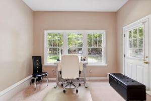 a home office with a desk and chairs and windows at Spacious Home by Kalahari Waterpark, Camelback and Jim Thorpe in Albrightsville