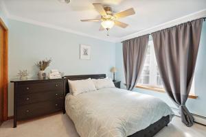 a bedroom with a bed and a ceiling fan at Spacious Home by Kalahari Waterpark, Camelback and Jim Thorpe in Albrightsville