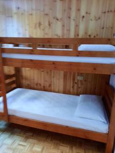 a couple of bunk beds in a room at Mansarda Carona in Carona
