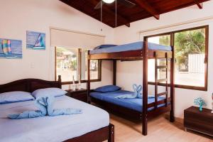 Postel nebo postele na pokoji v ubytování Perfect Ocean Hideaway!!! + 37 fotografií
