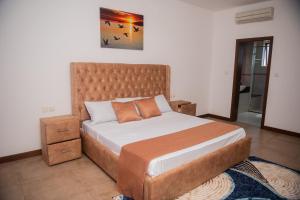 Postel nebo postele na pokoji v ubytování Njakaimba Beachfront Villa.