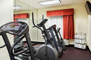 a gym with three exercise bikes in a room at Holiday Inn Express Hotel & Suites Knoxville-North-I-75 Exit 112, an IHG Hotel in Knoxville